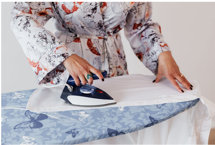 a lady using a stea iron